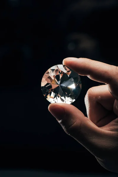 Cropped View Man Holding Big Clear Shiny Diamond Black Background — Stock Photo, Image