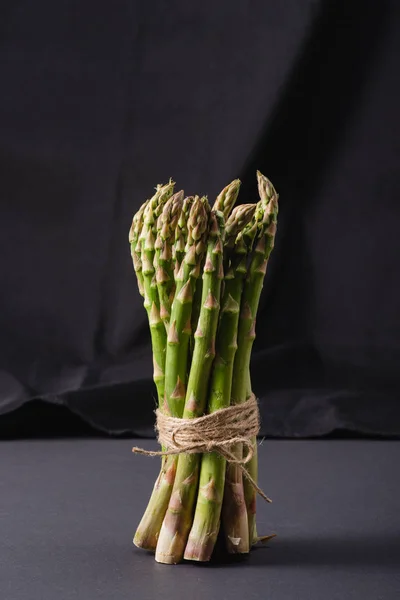 Bunch Green Uncooked Asparagus Tied Rope Black Background — Stock Photo, Image