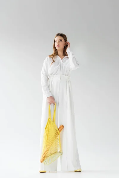 Young Woman Holding Yellow String Bag Baguette Bottle Milk While — Stock Photo, Image