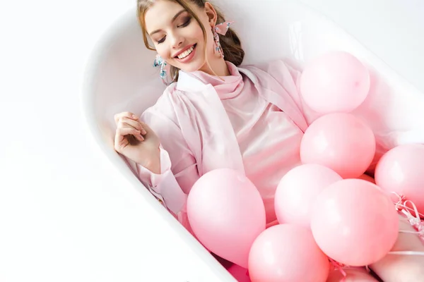 Cheerful Young Woman Lying Bathtub Pink Air Balloons White — Stock Photo, Image