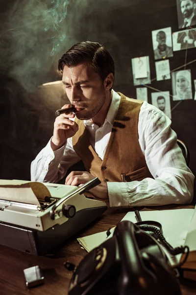 Pensive Detective Smoking Cigar While Using Typewriter Dark Office — Stock Photo, Image