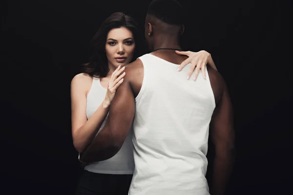 Beautiful Seductive Woman Embracing African American Man Looking Camera Isolated — Stock Photo, Image