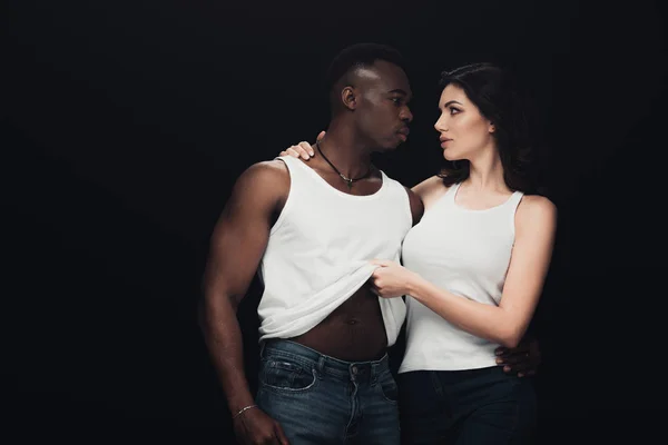 Beautiful Woman Undressing Muscular African American Man Isolated Black — Stock Photo, Image