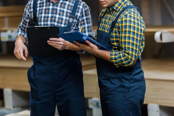 Cropped View Two Multicultural Warehouse Workers Uniform Holding Clipboards — Stock Photo, Image
