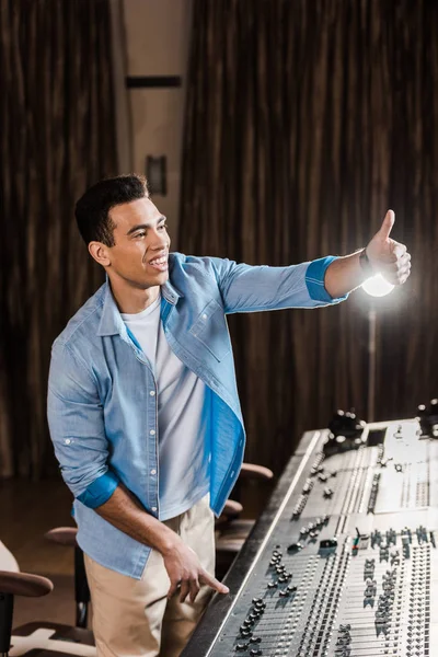 Cheerful Mixed Race Sound Producer Showing Thumb While Working Mixing — Stock Photo, Image