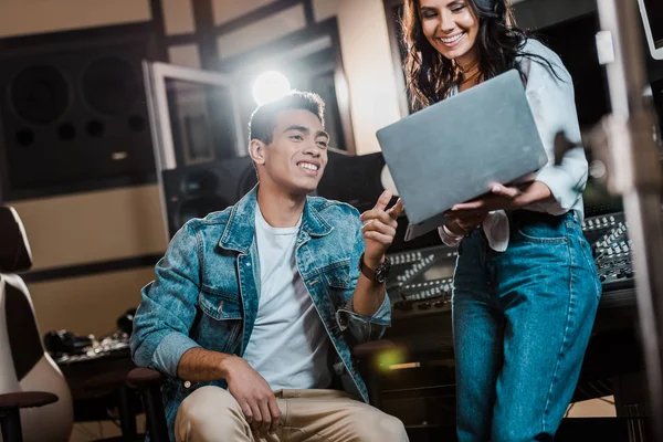 Smiling Multicultural Sound Producers Using Laptop Recording Studio — Stock Photo, Image