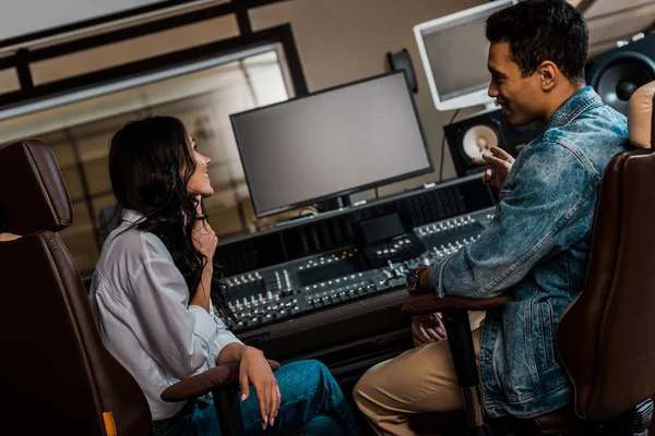 Two Young Smiling Sound Producers Working Sitting Mixing Console While — Stock Photo, Image