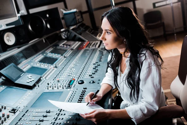 Attractive Sound Producer Writing Paper While Working Recording Studio — Stock Photo, Image