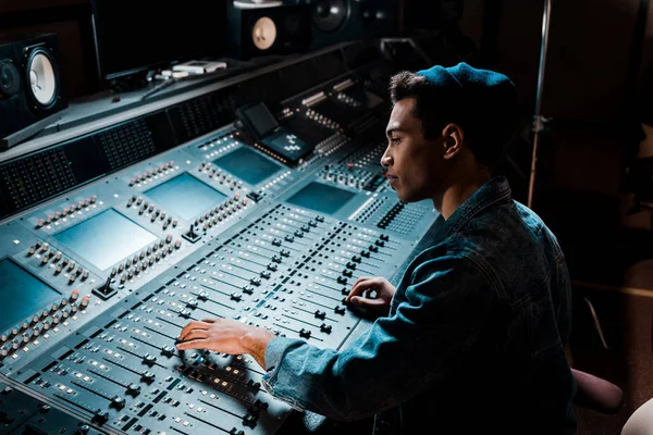 Concentrated Mixed Race Sound Producer Working Mixing Console Dark Recording — Stock Photo, Image