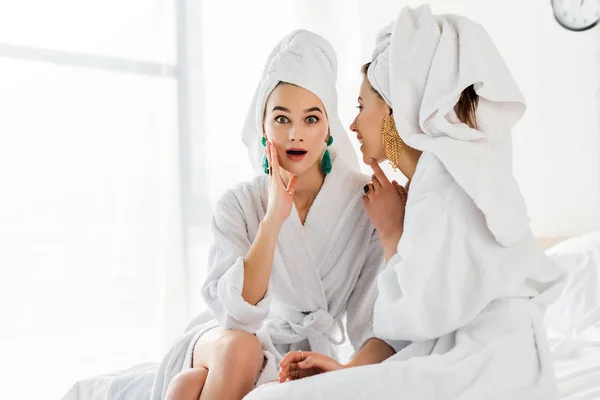 Stylish Shocked Girl Earrings Bathrobe Towel Head Talking Friend While — Stock Photo, Image