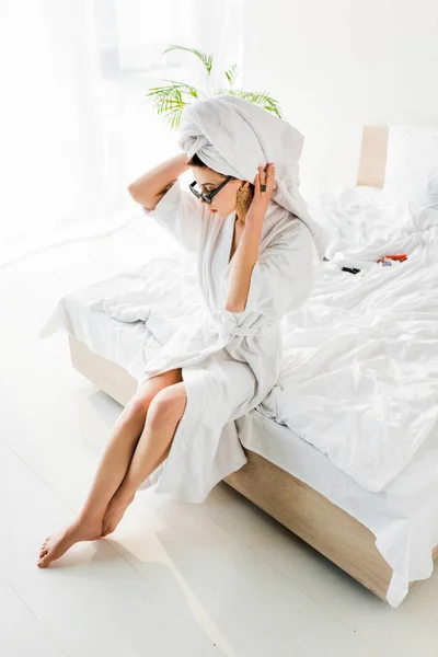 Stylish Barefoot Woman Bathrobe Sunglasses Towel Jewelry Sitting Bed — Stock Photo, Image