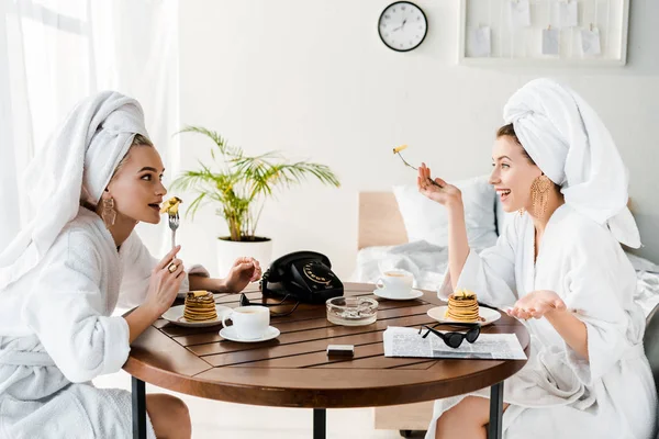 Stylish Happy Women Bathrobes Jewelry Towels Heads Talking Breakfast — Stock Photo, Image