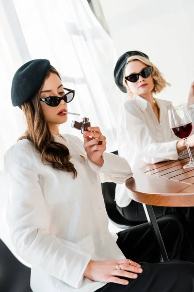 Elegant Woman Black Beret Sunglasses Lighting Cigarette Friend — Stock Photo, Image