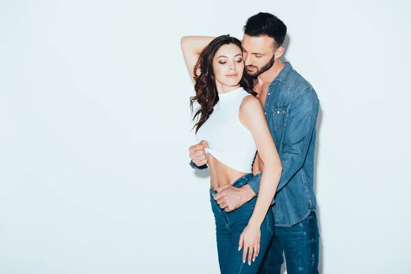 Bearded Man Jeans Undressing Girlfriend Grey — Stock Photo, Image