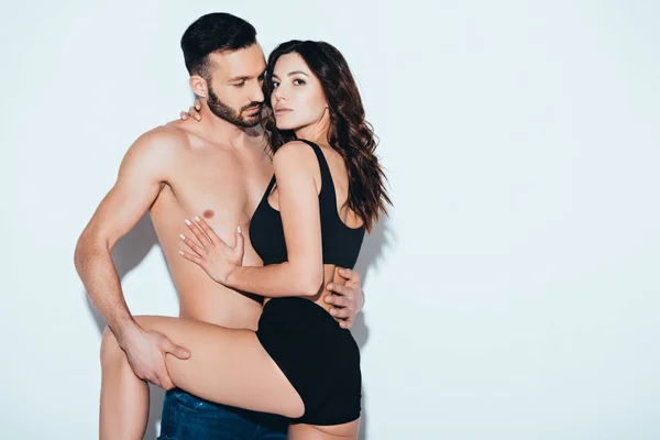 Sexy Girl Underwear Embracing Boyfriend Grey — Stock Photo, Image