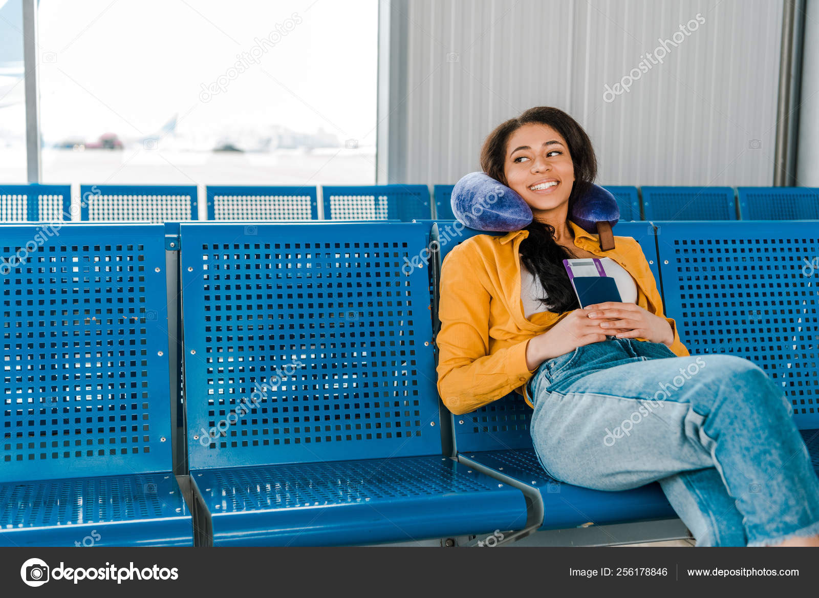Smiling African American Woman Sitting Travel Pillow Passport Air