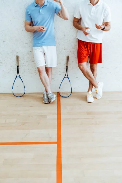 Cropped View Two Squash Players Shorts Standing Crossed Legs Four — Stock Photo, Image
