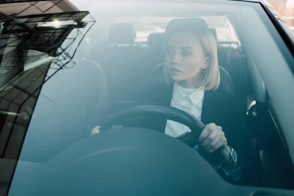 Pensive Blonde Driver Holding Steering Wheel While Driving Car — Stock Photo, Image