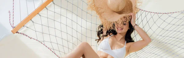 Panoramic Shot Beautiful Smiling Girl Bikini Holding Straw Hat While — Stock Photo, Image