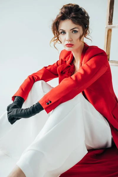 Upset Trendy Young Woman Red Hair Looking Camera Sitting White — Stock Photo, Image