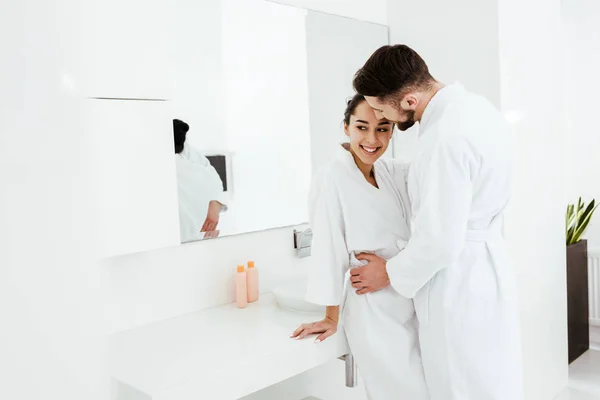 Handsome Man Hugging Happy Girlfriend Standing Smiling Bathrobe — Stock Photo, Image