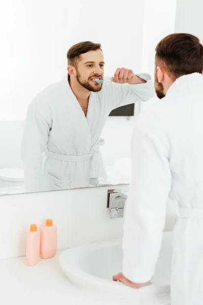 Selective Focus Handsome Man Brushing Teeth While Looking Mirror Bathroom — Stock Photo, Image