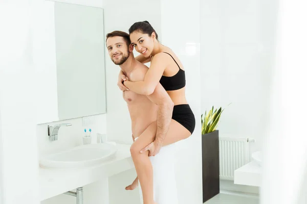 Cheerful Shirtless Man Piggybacking Brunette Girlfriend Black Underwear — Stock Photo, Image