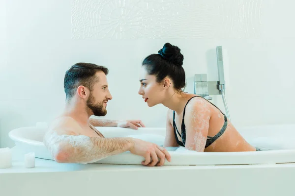 Handsome Shirtless Man Lying Bathtub Looking Sexy Brunette Woman Lace — Stock Photo, Image