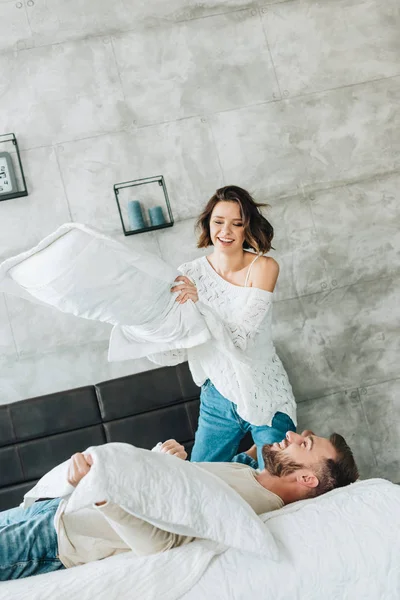 Low Angle View Cheerful Woman Having Pillow Fight Handsome Bearded — Stock Photo, Image
