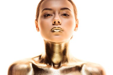 portrait of nude young woman painted in golden looking at camera isolated on white clipart