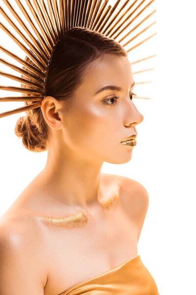 young beautiful woman with golden glittery makeup and accessory on head looking away isolated on white