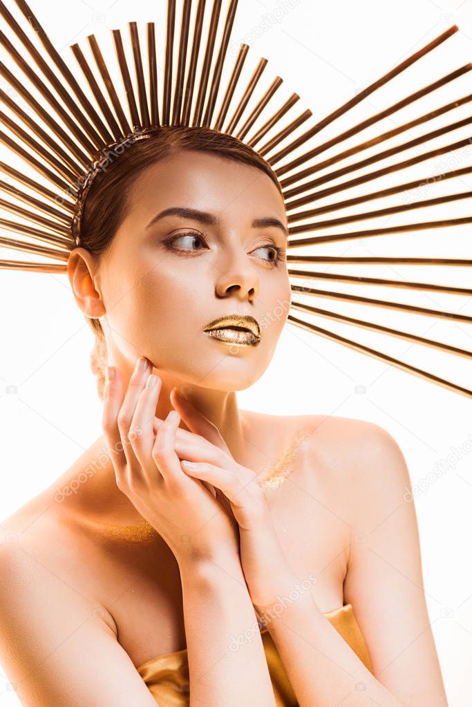 young beautiful woman with golden glittery makeup and accessory on head isolated on white