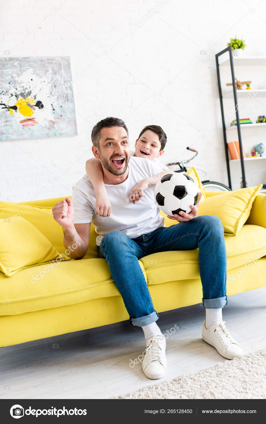 Excited Father Son Watching Sports Match Cheering Living