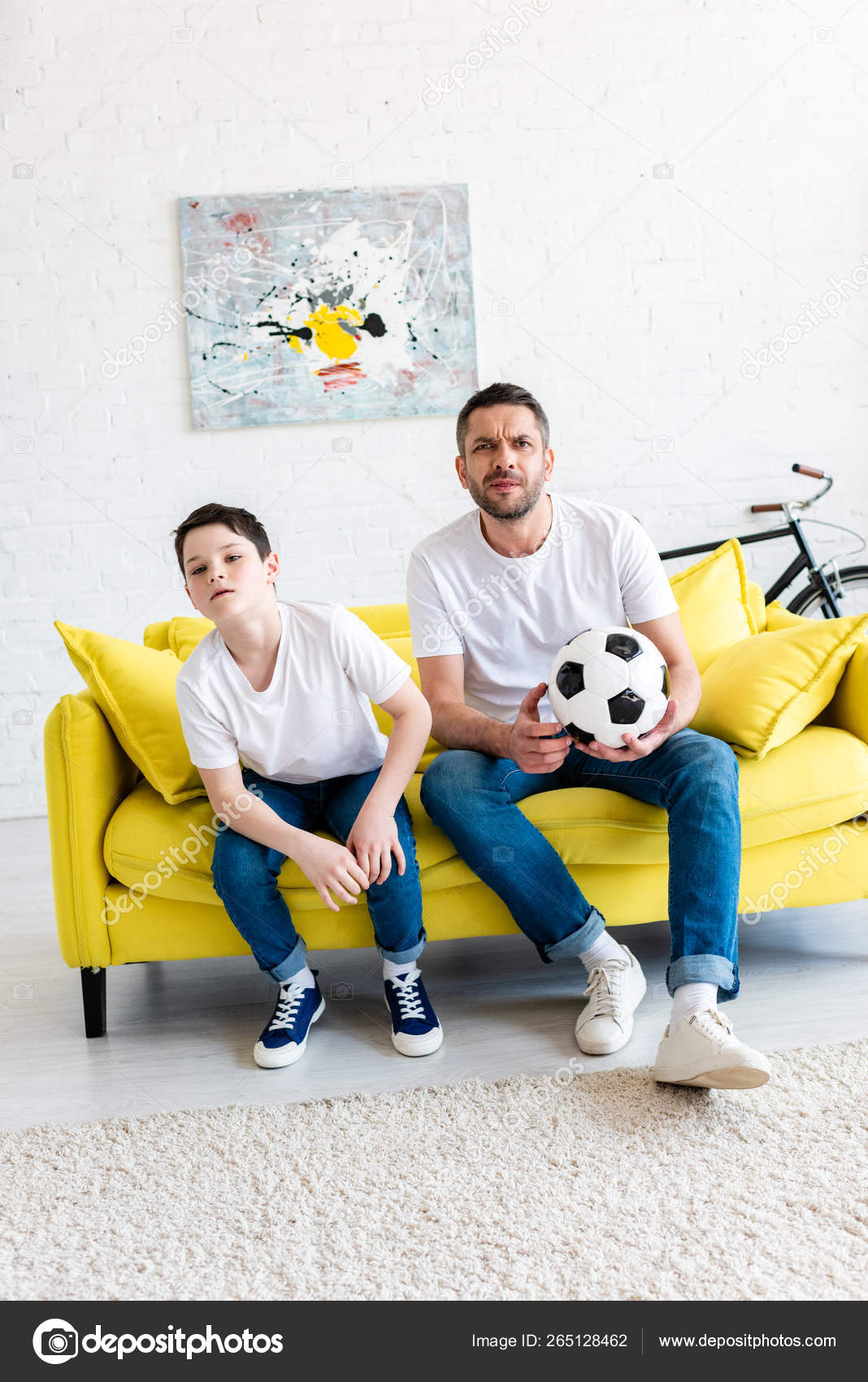 Father Son Watching Sports Match Couch Soccer Ball Home Stock Father Son Watching Sports Match Couch Soccer Ball Home Stock Photo