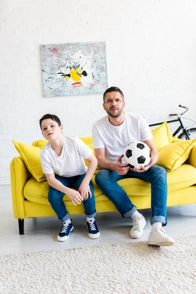 Father Son Watching Sports Match Couch Soccer Ball Home — Stock Photo, Image