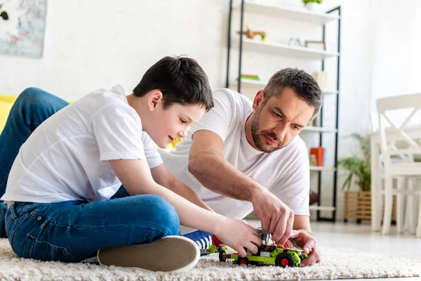 Father Son Sitting Carpet Playing Toy Car Home Living Room — Stock Photo, Image