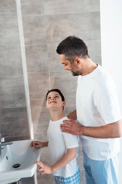 Happy Father Hugging Son Bathroom Morning Routine — Stock Photo, Image