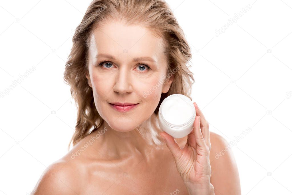 beautiful nude mature woman holding container with cosmetic cream Isolated On White