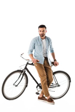 serous bearded man with bicycle looking at camera isolated on white clipart