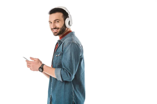 Smiling Man Headphones Using Smartphone Looking Camera Isolated White — Stock Photo, Image