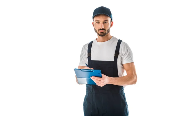 Serious Delivery Man Writing Clipboard Looking Camera Isolated White — Stock Photo, Image