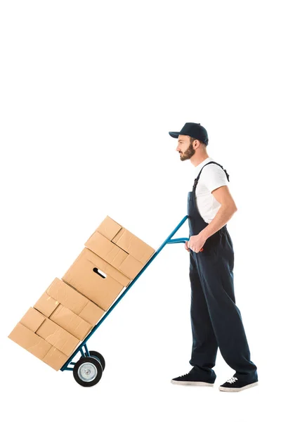 Serious Delivery Man Transporting Hand Truck Loaded Cardboard Boxes Isolated — Stock Photo, Image