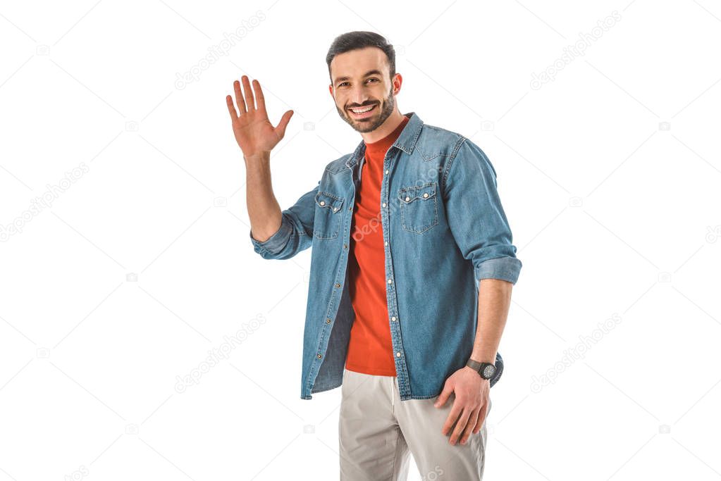 handsome smiling man looking at camera and showing hello gesture isolated on white