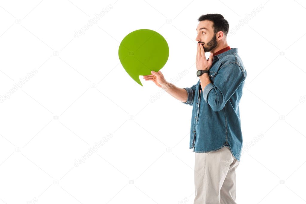 surprised man with thought bubble covering mouth with hand isolated on white