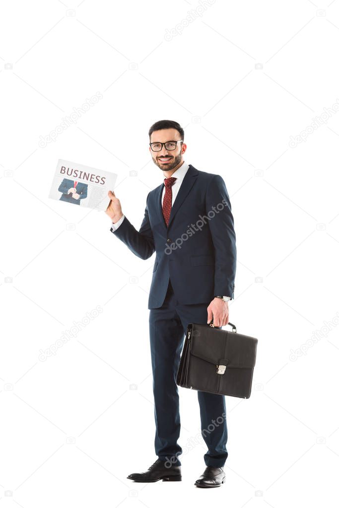 smiling businessman with briefcase holding business newspaper isolated on white