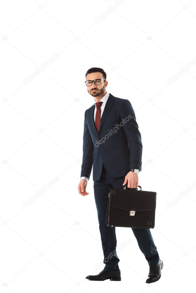 confident businessman with briefcase looking at camera isolated on white