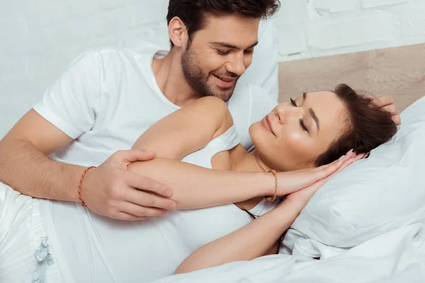 Happy Man Looking Attractive Girl Lying Bed Closed Eyes — Stock Photo, Image