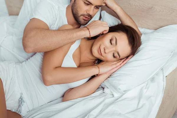 Handsome Man Touching Attractive Woman Lying Bed Closed Eyes — Stock Photo, Image