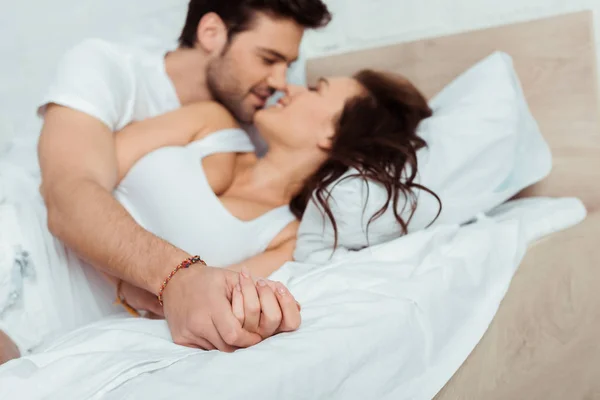 Selective Focus Cheerful Couple Holding Hands While Lying Bedroom — Stock Photo, Image