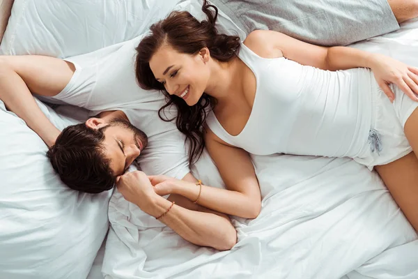 Top View Cheerful Woman Looking Man While Holding Hands Lying — Stock Photo, Image